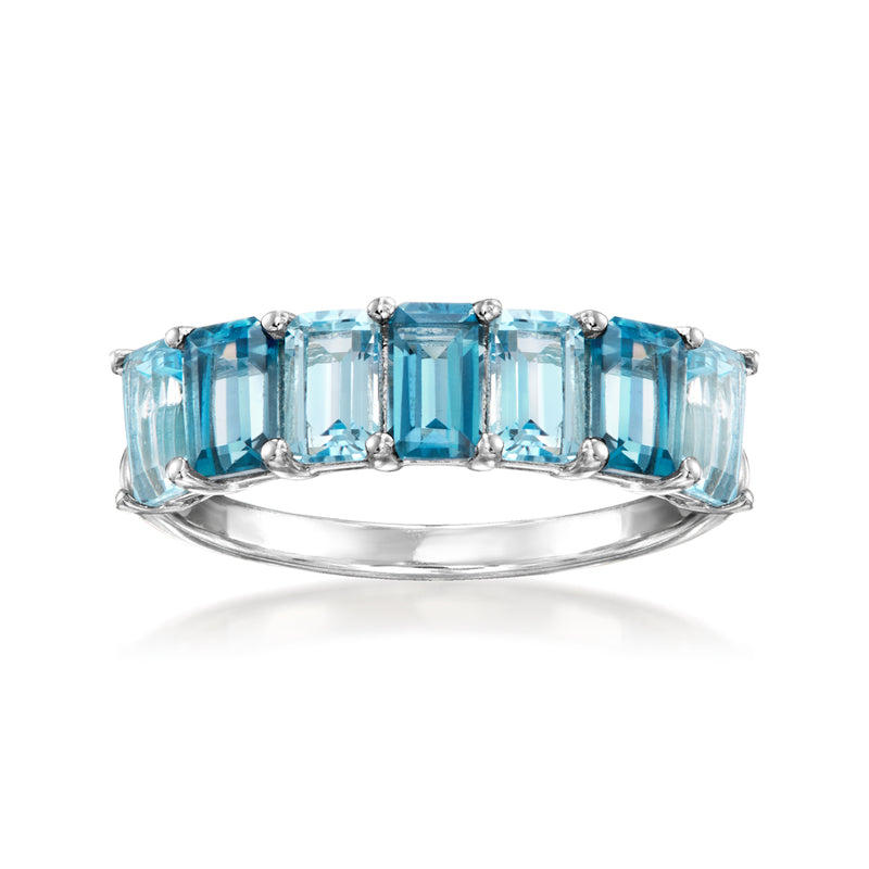 Sterling silver ring with a row of rectangular blue topaz gemstones
