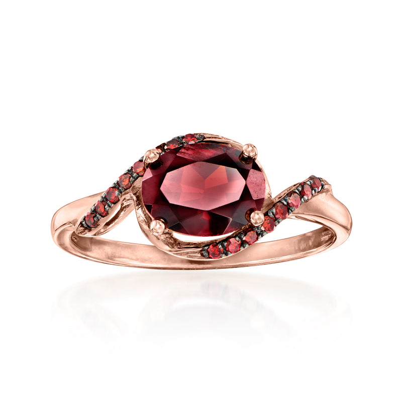 14kt rose gold garnet ring with oval red gemstone halo and side red stones