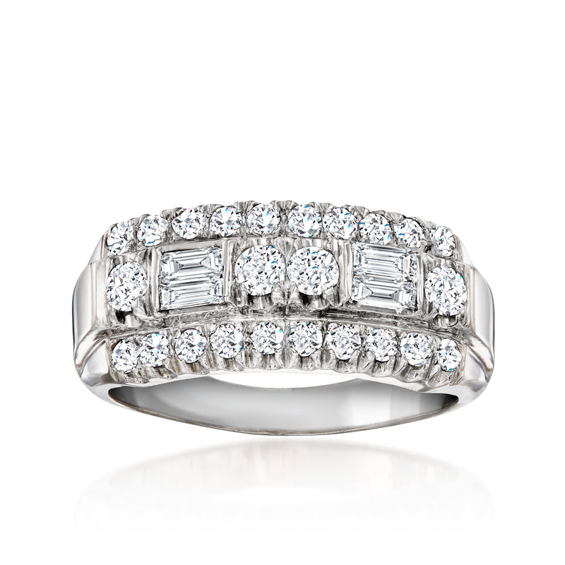 Vintage platinum diamond ring with baguette and round stones, prong-set with polished band