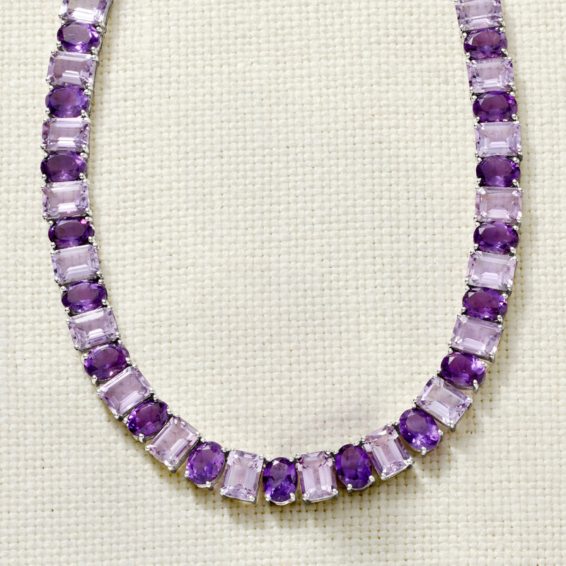 Close-up of sterling silver amethyst tennis necklace with purple rectangular stones