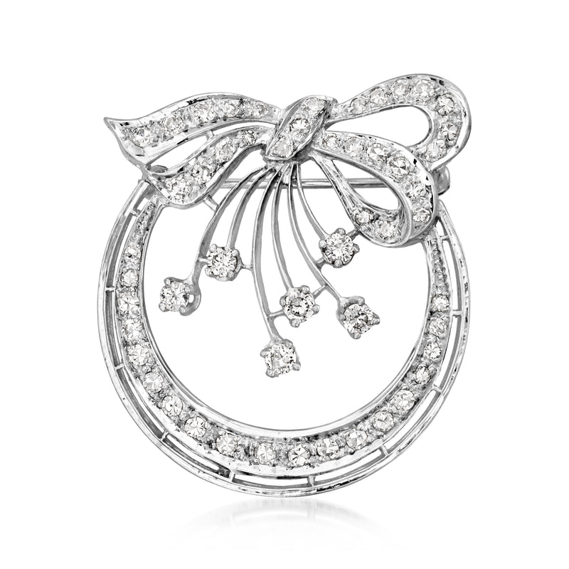 Vintage diamond circle bow pin in white gold, circular frame with dangling stones