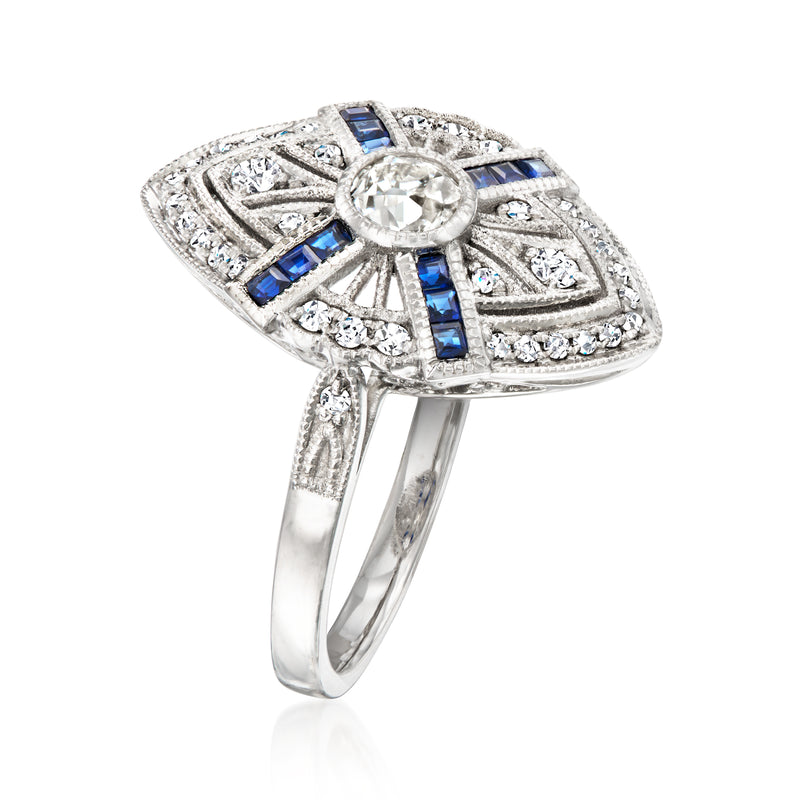 Platinum filigree ring with oval halo of diamonds and blue sapphire baguette accents