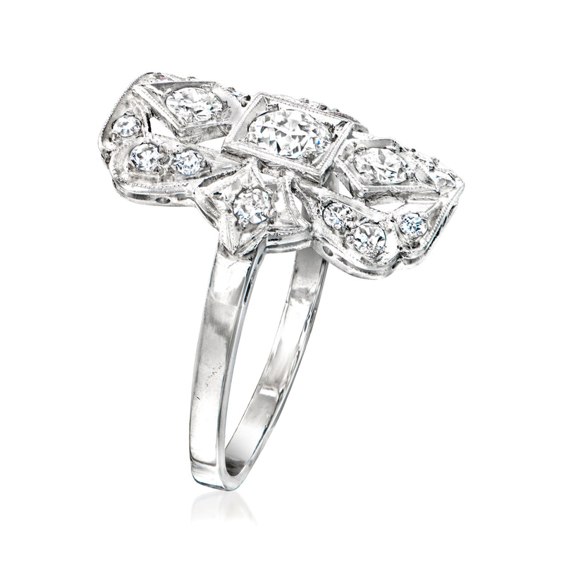 Platinum diamond filigree ring with openwork setting and prong-set stones