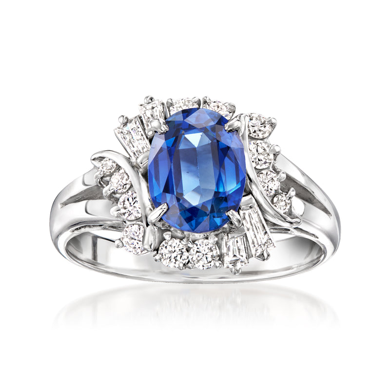 Platinum ring with oval blue sapphire center and diamond halo and side accents