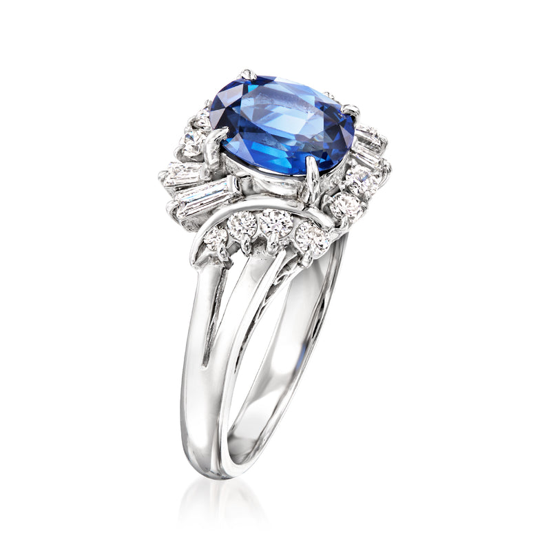 Platinum sapphire ring with large blue center stone and surrounding baguette diamonds