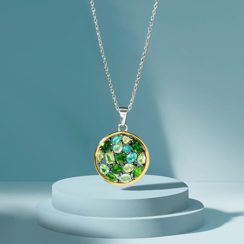 Multi-gemstone round pendant necklace on a silver chain with yellow gold edge