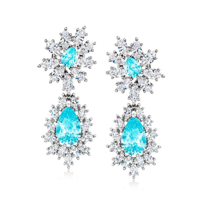 Sterling silver drop earrings with blue teardrop stones and clear CZ cluster details