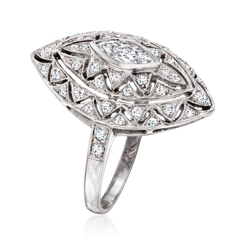 Marquise-shaped diamond ring with ornate side scrollwork, 18kt white gold band