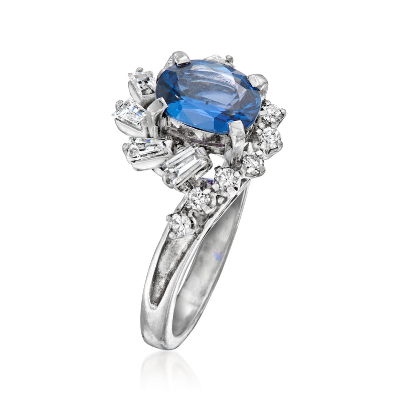 Platinum ring with large oval blue sapphire and mixed-cut diamonds, side view, size 5