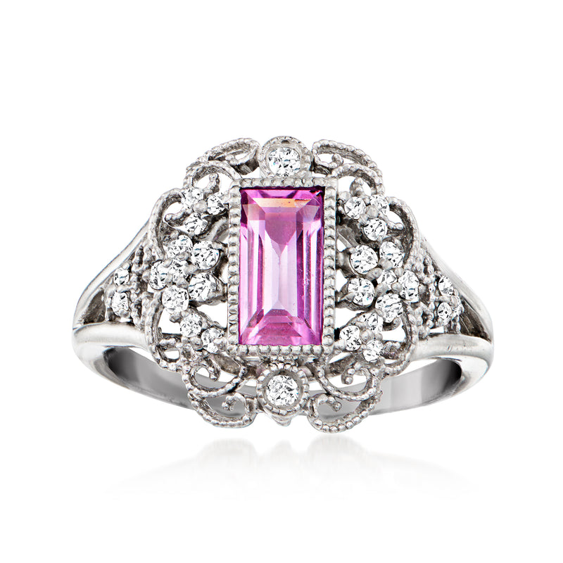Vintage platinum ring with rectangular pink sapphire center and round diamond halo