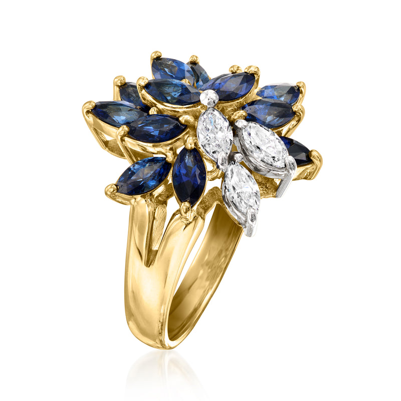 Yellow gold cluster ring with blue sapphires and pear-shaped diamond center