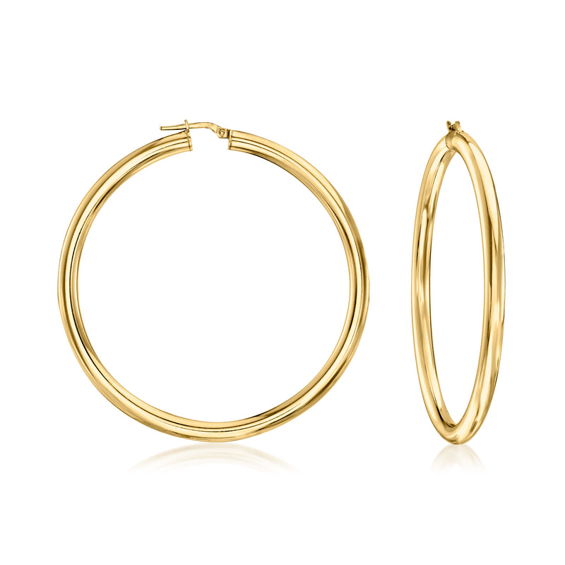 Large polished gold-tone hoop earrings with hinged closure, round loop design