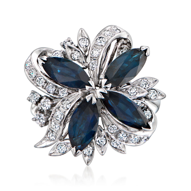 Vintage sapphire and diamond swirl ring in 14kt white gold with blue center petals