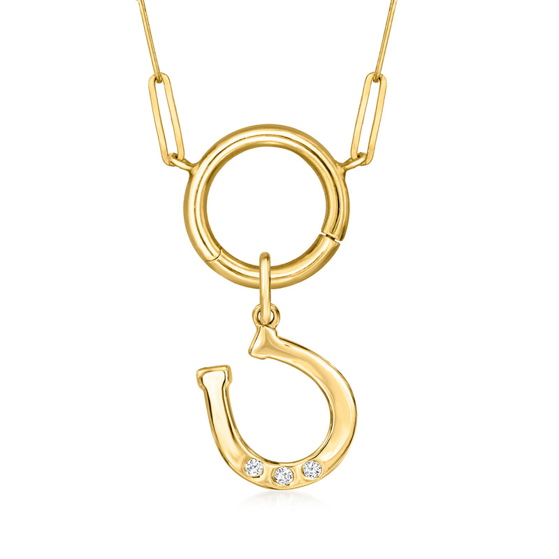 Yellow gold horseshoe charm with diamond accents on a hanging bail