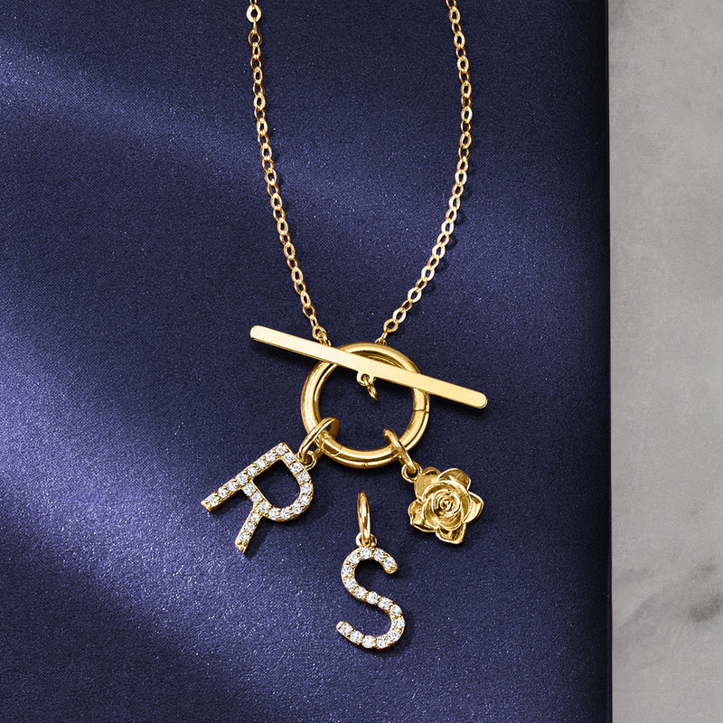 14kt yellow gold diamond initial charm with R, S, and rose charms
