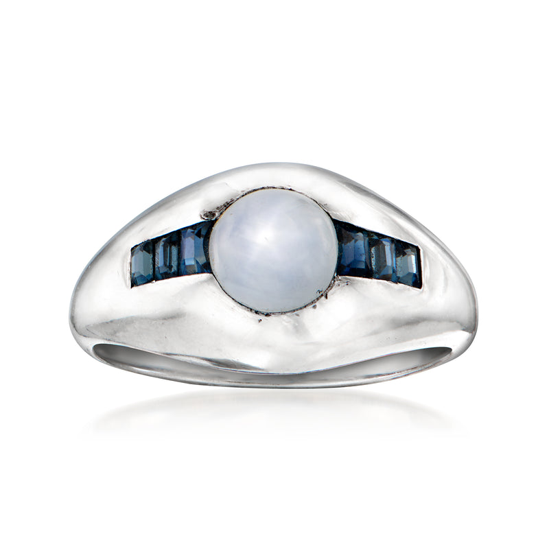 Platinum vintage ring with oval white center and blue baguette side stones