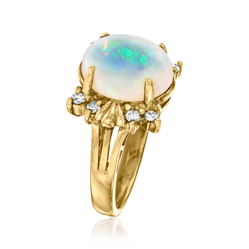 18k yellow gold ring with oval opal cabochon and prong-set diamond cluster