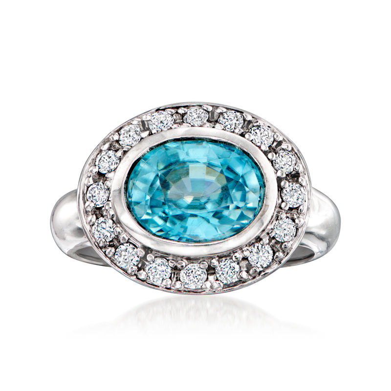 Vintage 14kt white gold ring with oval blue zircon center and diamond halo