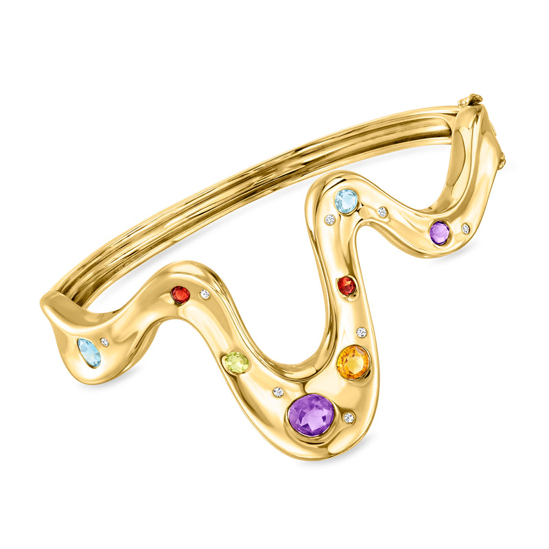 Gold-tone wavy bangle bracelet with multicolor gemstones and small clear stones accents