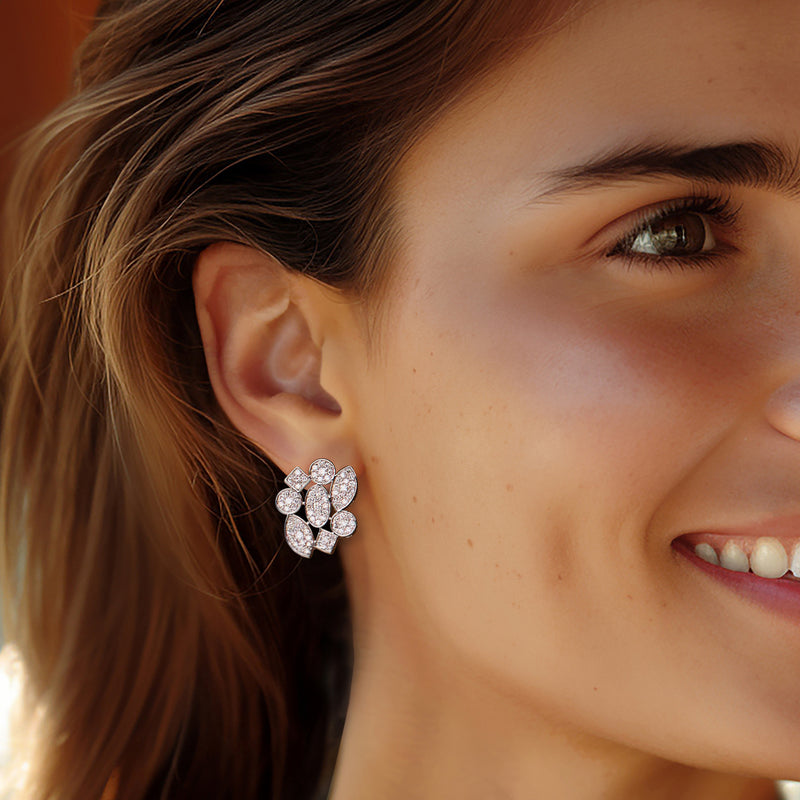 Vintage diamond geometric cluster earrings in white gold, shown on one ear