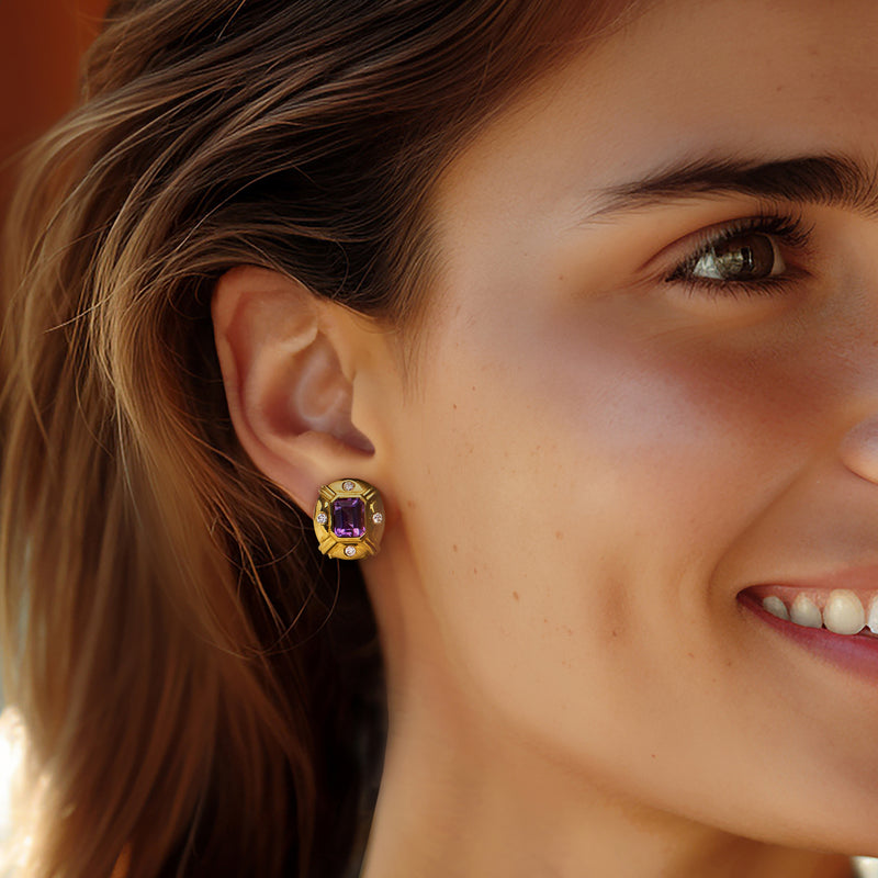 Amethyst and diamond clip-post earrings in 18kt yellow gold on model’s ear