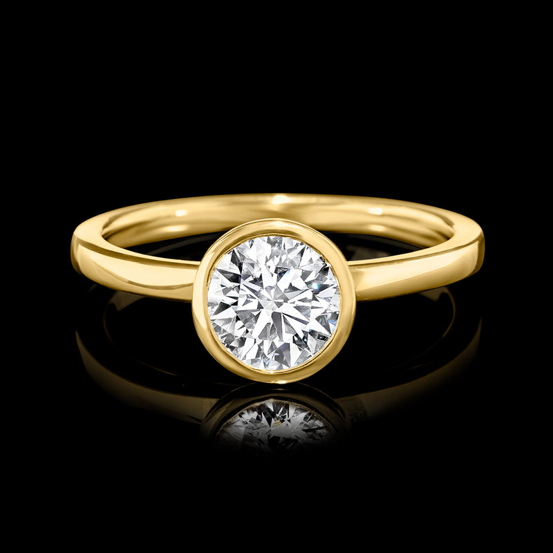 14kt yellow gold solitaire ring with round bezel-set lab diamond, polished band