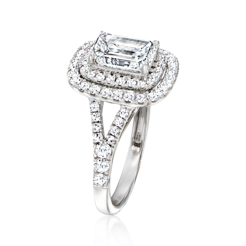 Side view of 14kt white gold halo ring with emerald-cut center diamond