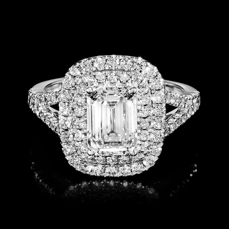 Front view of 14kt white gold halo ring with emerald-cut center diamond