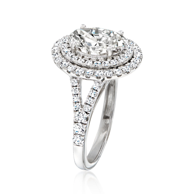 Oval diamond halo ring in 14kt white gold, side view with split shank