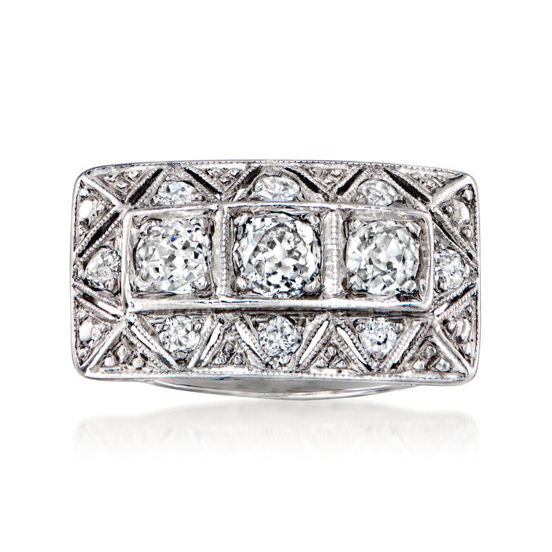 Vintage 18kt white gold diamond filigree ring with three round stones, rectangular setting