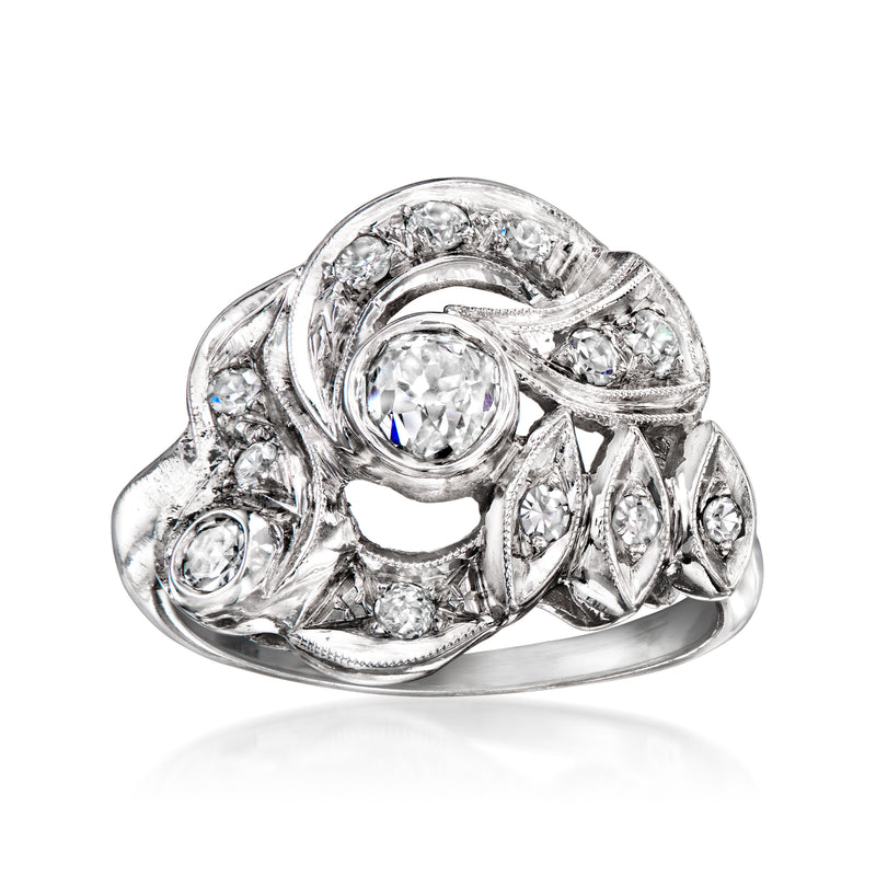 Vintage 14k white gold diamond ring with oval center stone and ornate halo setting