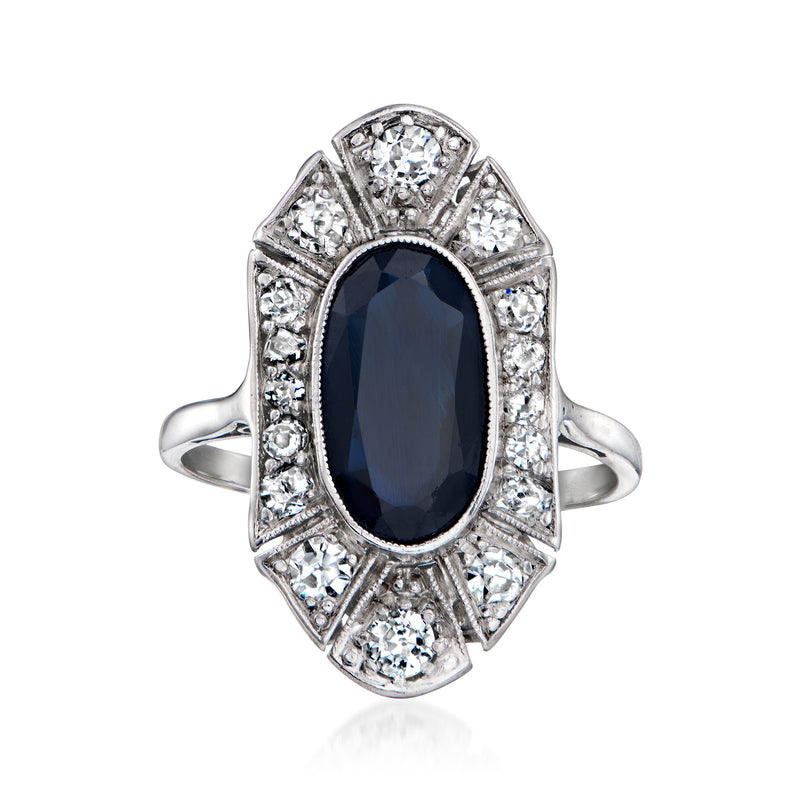Vintage sapphire and diamond ring in 18k white gold, oval center stone with halo