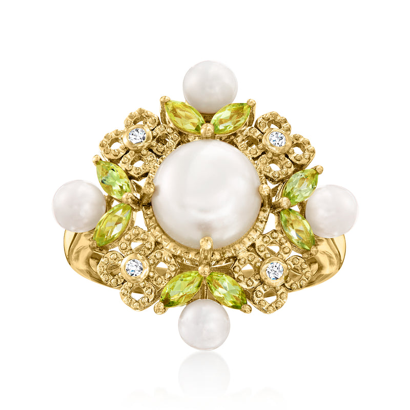 Gold ring with white cultured pearl, green peridot, and small clear zircon accents
