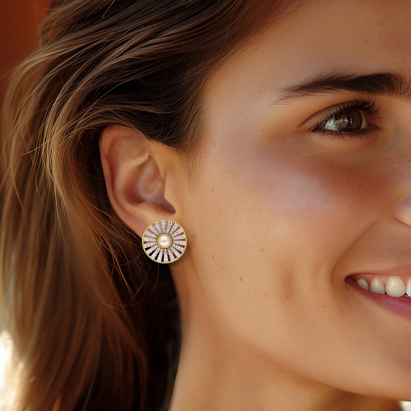 White pearl zircon sunburst stud earrings on ear, gold tone post style