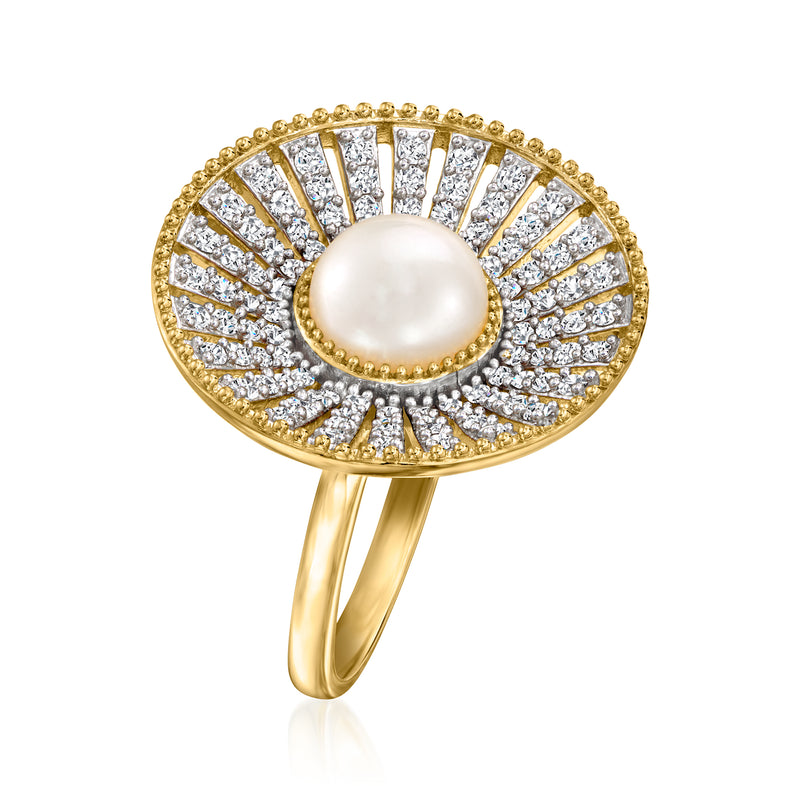 Gold ring with round pearl and radiating clear zircon stones on the band
