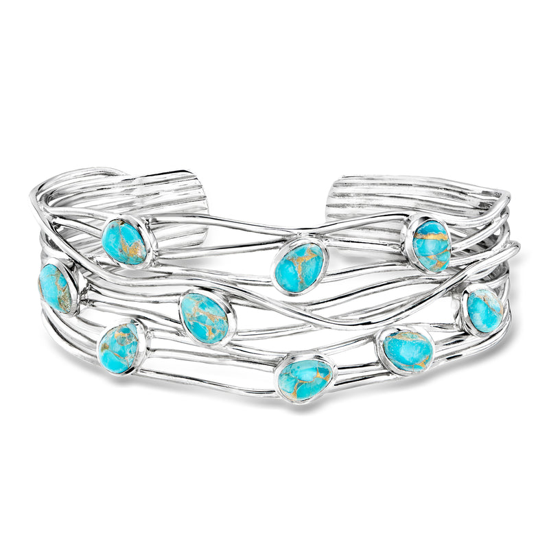 Turquoise stone cuff bracelet in sterling silver with oval cabochons and ribbon-like wire