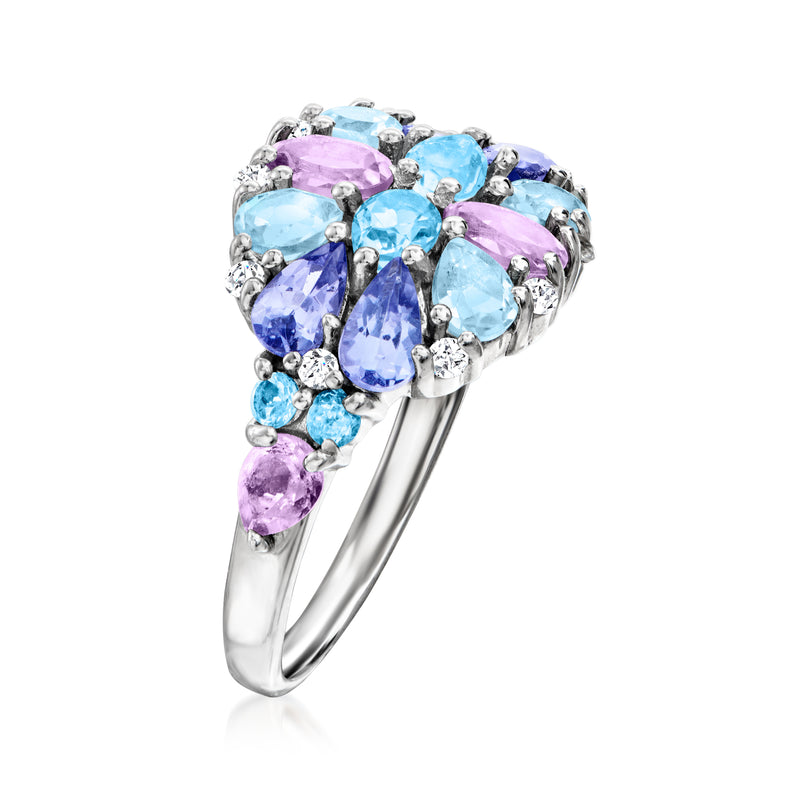 Sterling silver ring with cluster of oval blue and purple stones and halo-style prongs