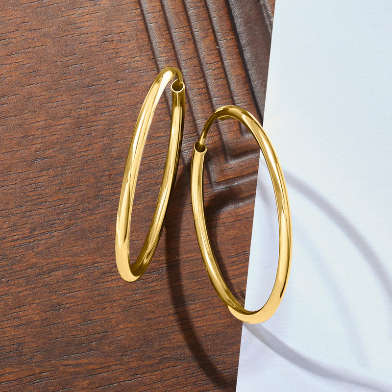 10k yellow gold hoop earrings with hinge clasp, shown at an angle