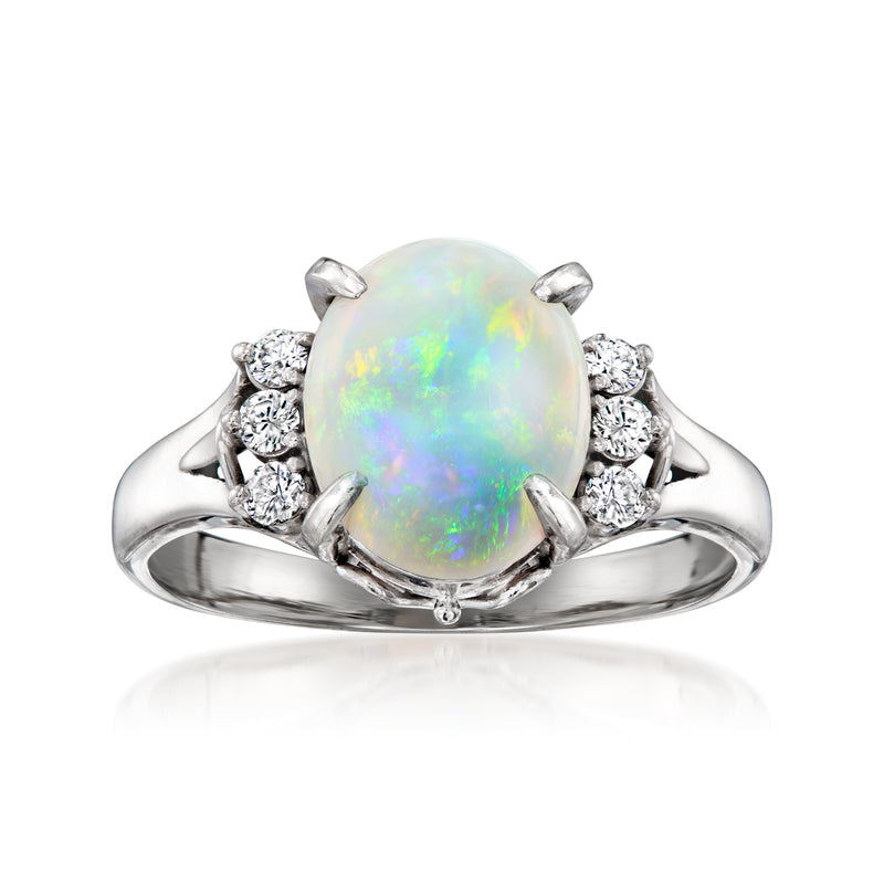 Vintage opal diamond halo ring in platinum with round opal center and side diamonds