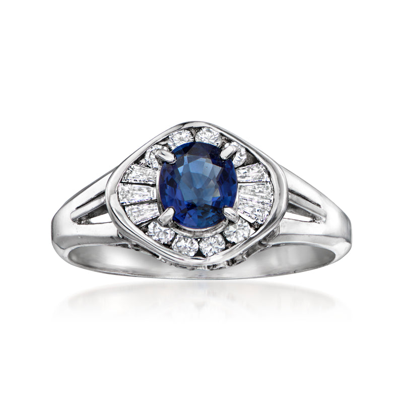 Platinum vintage ring with oval blue sapphire and diamond halo and side stones
