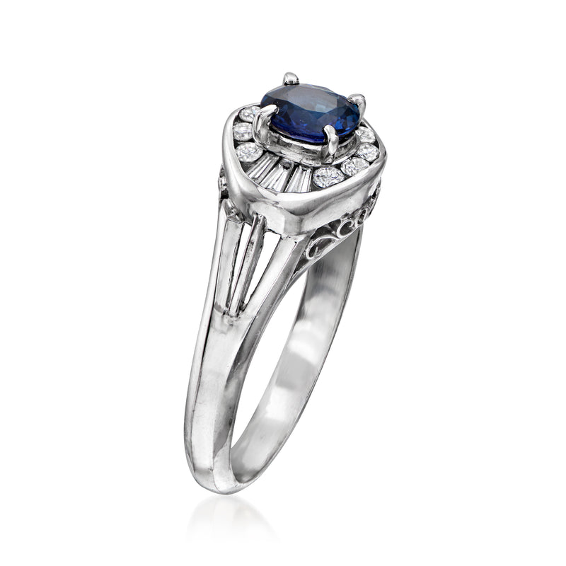 Platinum ring with raised blue sapphire and diamond baguette accents