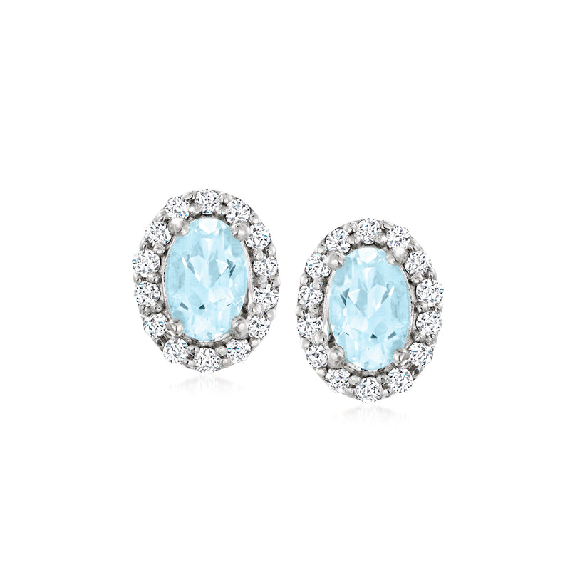 Sterling silver stud earrings with oval sky blue stones and white zircon halos