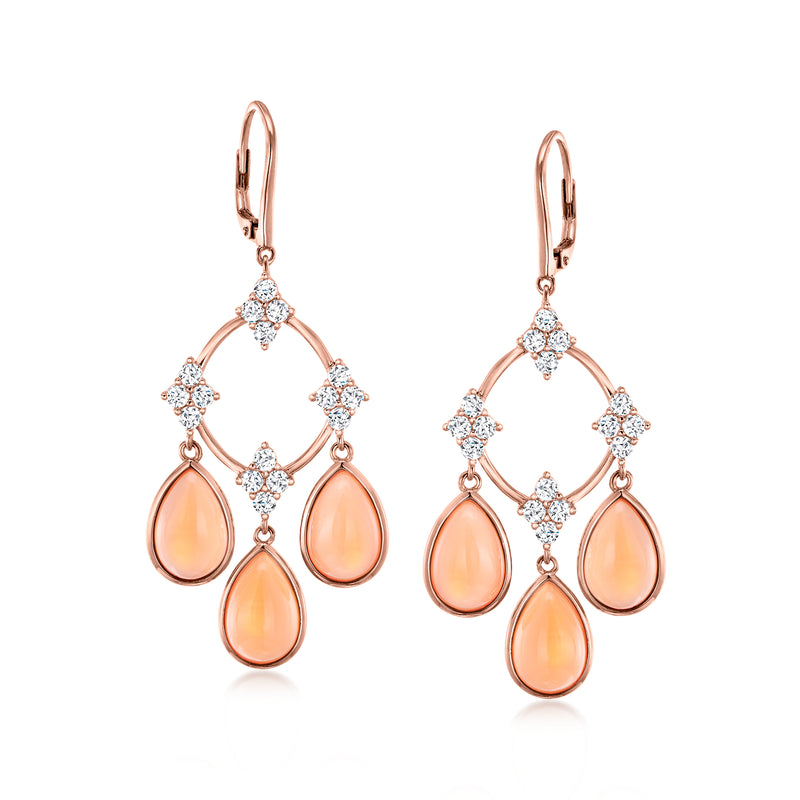 Rose gold chandelier earrings with peach teardrop stones and white sparkle accents, leverback