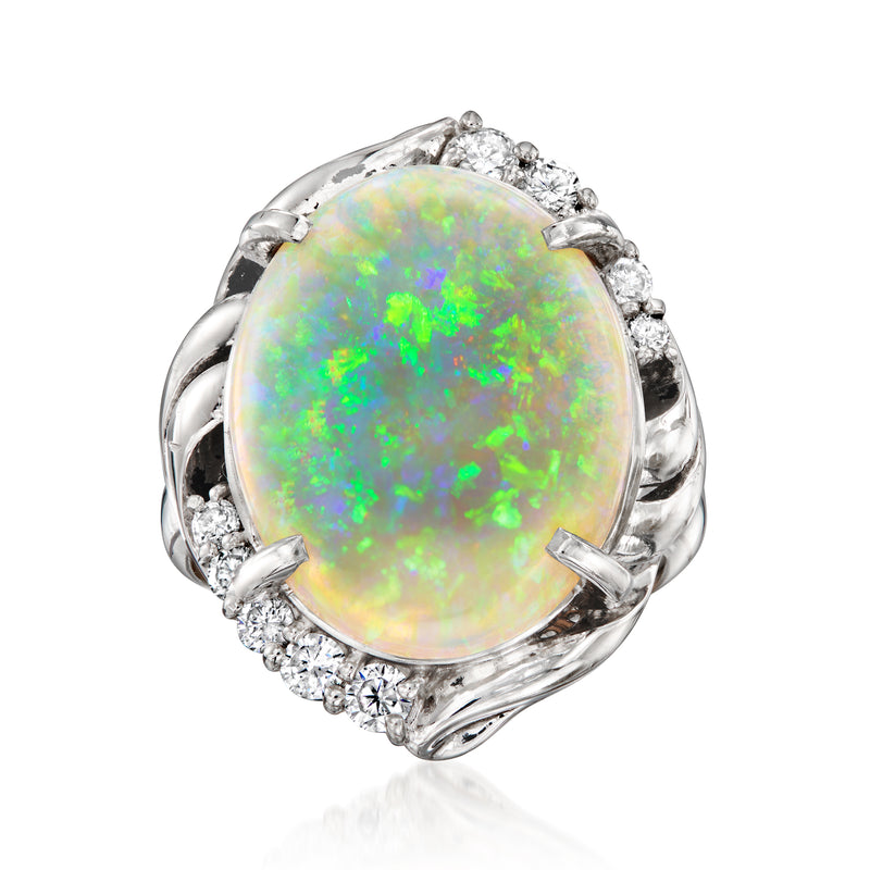 Vintage opal and diamond ring in platinum, oval opal with diamond halo
