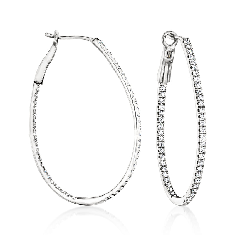 Sterling silver oval hoop earrings with inside-out diamond accents and clip/post backs