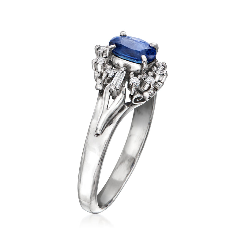 Platinum sapphire and diamond ring with oval blue gemstone and cluster prong setting