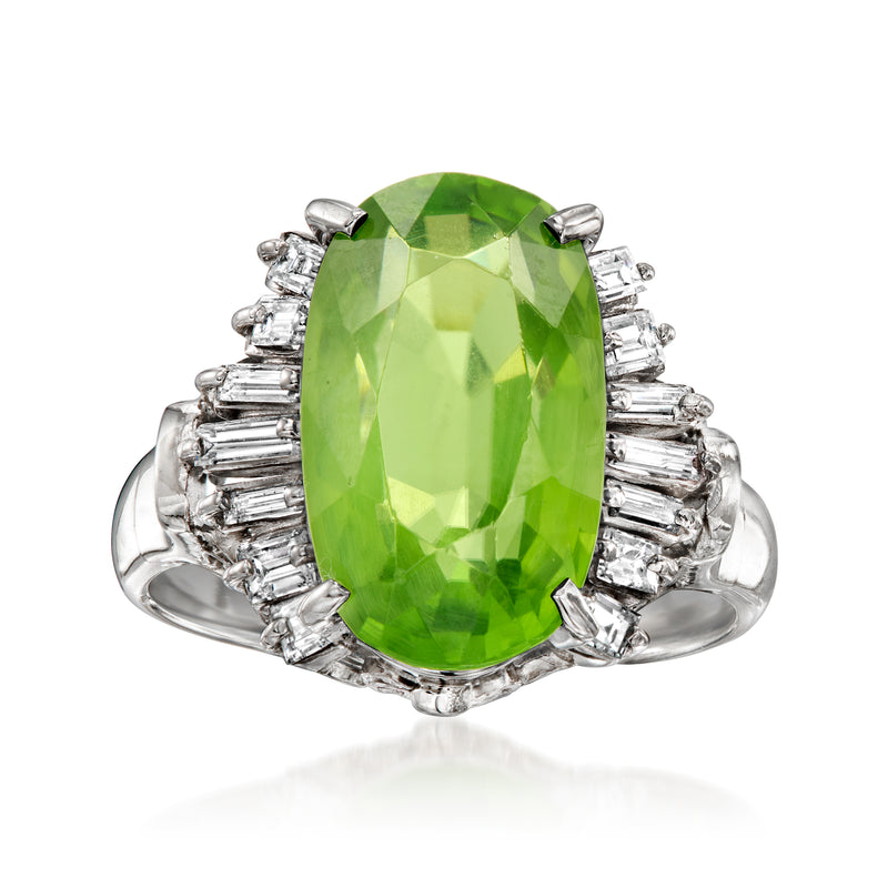 Platinum ring with large green peridot center and baguette-cut diamond side accents