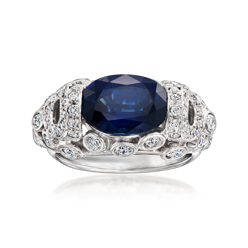 Vintage sapphire and diamond ring in platinum, oval blue center stone with halo detail