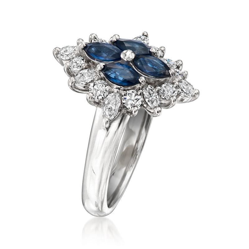 Platinum ring with marquise blue sapphires and diamond cluster halo