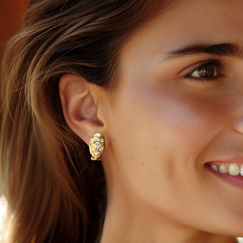 Diamond checkerboard oval stud earrings in 18kt yellow gold on model